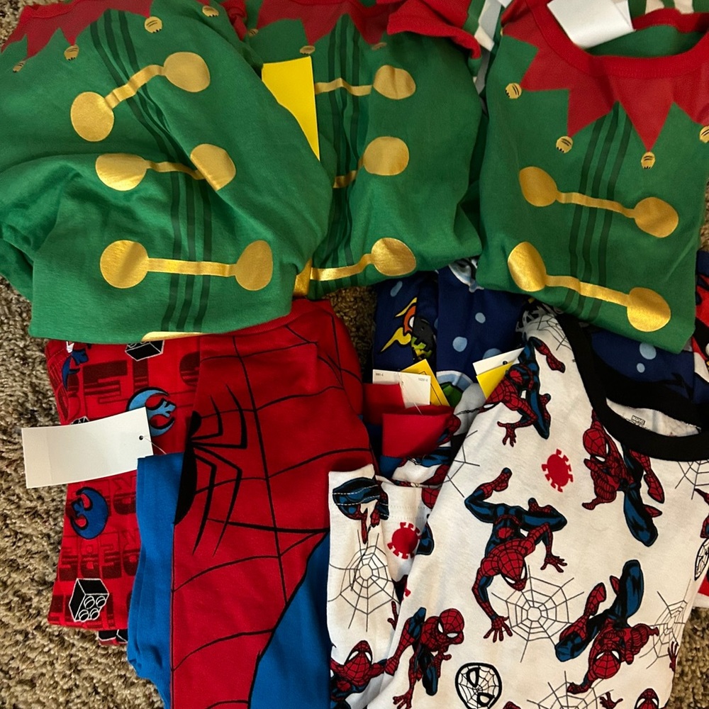 Six pairs of Boys Size 10 Pajamas. New with tags.